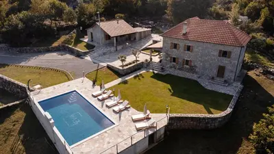 an aerial view of a house with a swimming pool at Etno Villa Mokanji in Danilovgrad