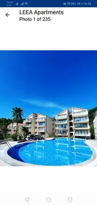 a picture of a swimming pool in front of a building at Beauty apartment in Blue star complex Pržno Montenegro in Pržno