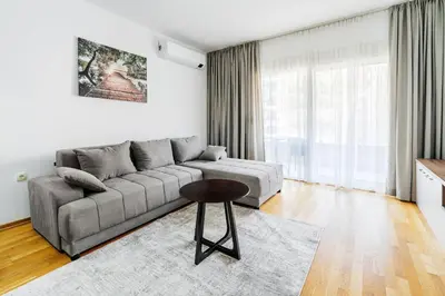 a living room with a couch and a table at Status-M Apartments 187 in Becici
