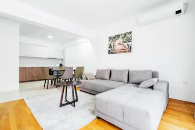 a living room with a couch and a table at Status-M Apartments 187 in Becici