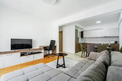 a living room with a couch and a flat screen tv at Status-M Apartments 187 in Becici