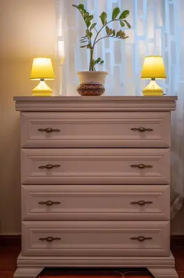 a dresser with two lamps and a plant on top at Casa al mare Petrovac, Montenegro in Petrovac na Moru