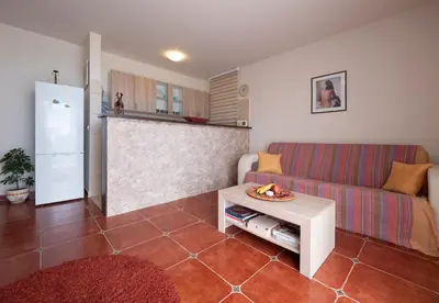 a living room with a couch and a table at Casa al mare Petrovac, Montenegro in Petrovac na Moru