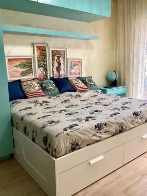 a bedroom with a large bed in a room at BUDVA LUX in Budva