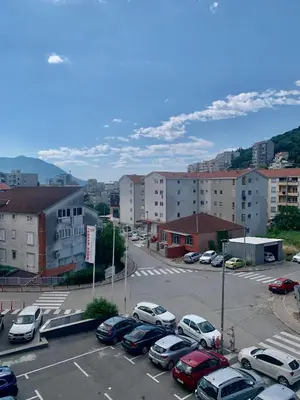 a parking lot with cars parked in a city at BUDVA LUX in Budva