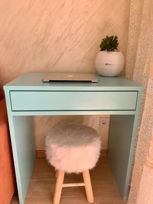 a blue desk with a laptop and a plant on it at BUDVA LUX in Budva