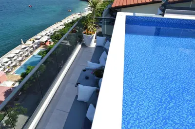 an overhead view of a swimming pool on top of a building at APARTMENTS MERLIN in Dobra Voda