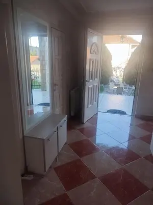a room with a door and a tiled floor at VILA LUKA in Podgorica