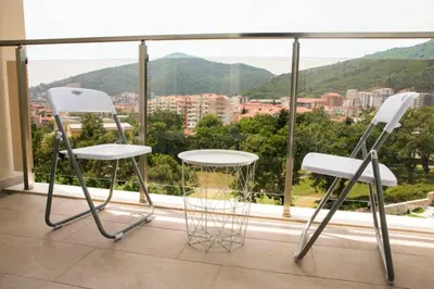 two chairs in front of a window with a view at Mina Studio Apartment Budva in Budva