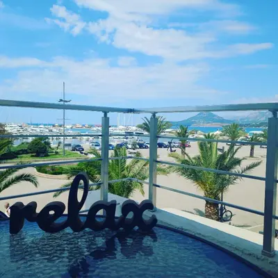 a view of the beach from the balcony of a resort at Passerella Apartments in Bar