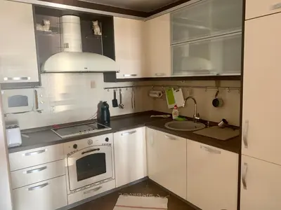 a small kitchen with white cabinets and a sink at Apartment Ruzmarin Petrovac in Petrovac na Moru