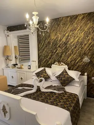 a bedroom with a bed with a snake on it at Beautiful House Lara in Kotor
