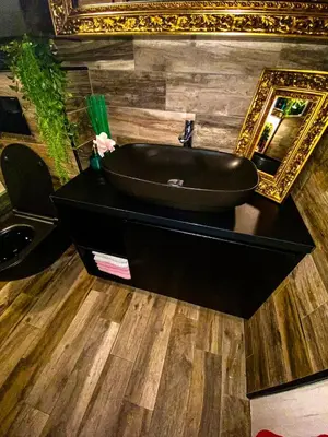 a bathroom with a black sink and a mirror at Beautiful House Lara in Kotor