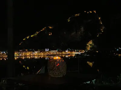 a vase sitting on a table at night at Beautiful House Lara in Kotor