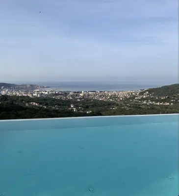 a view of a city with the ocean in the background at Apartman Livada Bar in Bar