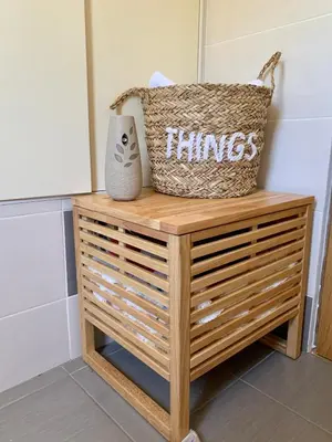 a table with a basket and a pillow on it at Apartman Livada Bar in Bar