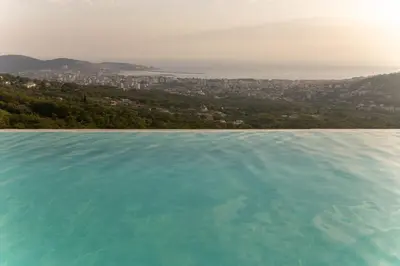 a large body of water with a city in the background at Apartman Livada Bar in Bar