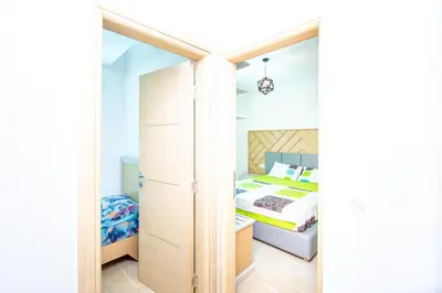 a small bedroom with a bed and a closet at Apartman DULY LUX in Pržno