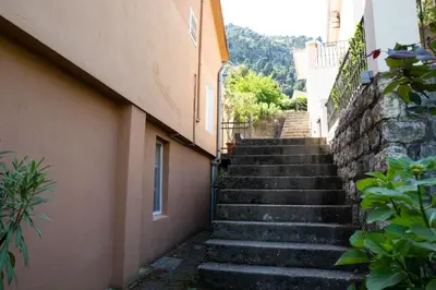 a set of stairs leading up to a building at M&B apartment in Kotor