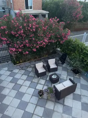 an overhead view of a patio with chairs and flowers at Villa Dafina in Donji Štoj