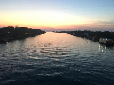 a view of a river at sunset at Villa Dafina in Donji Štoj