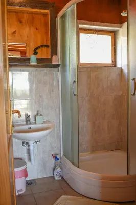 a bathroom with a shower and a sink and a tub at Guest House Scepanovic in Sutomore