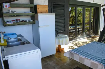 a kitchen with a sink and a refrigerator at Guest House Scepanovic in Sutomore
