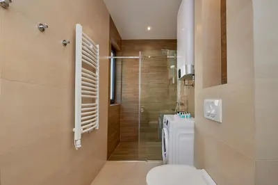 a bathroom with a shower and a toilet and a sink at BigMontenegro Dreams in Becici