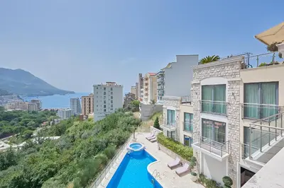 a view from the balcony of a building with a swimming pool at BigMontenegro Dreams in Becici