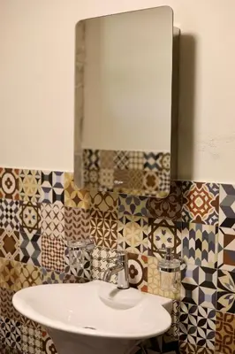 a bathroom with a sink and a mirror at Mountains Villa near Budva in Budva