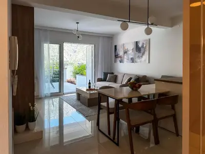 a living room with a table and a couch at ChillOut apartment in Kotor Bay in Kotor