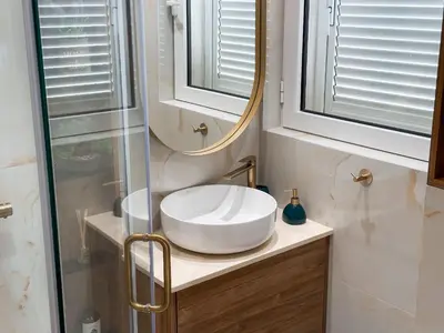 a bathroom with a sink and a mirror at ChillOut apartment in Kotor Bay in Kotor
