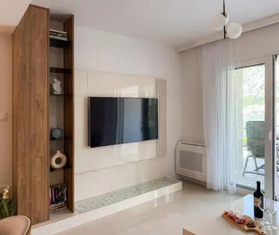 a living room with a flat screen tv on a wall at ChillOut apartment in Kotor Bay in Kotor