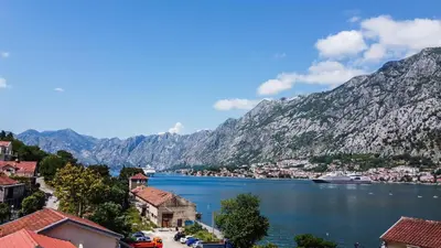 a view of a body of water with mountains at ChillOut apartment in Kotor Bay in Kotor