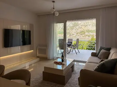 a living room with a couch and a tv at ChillOut apartment in Kotor Bay in Kotor