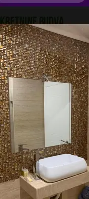 a bathroom with a white sink and a mirror at Luxury apartment in Victoria Palace Budva center in Budva