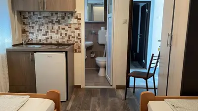a small bathroom with a sink and a toilet at Vila Marina in Sutomore