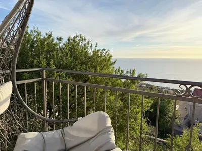 a view of the ocean from a balcony at Almond Apartments in Sveti Stefan