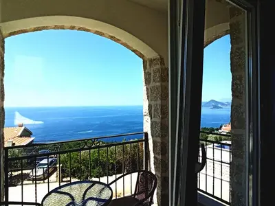 a balcony with a view of the ocean at Almond Apartments in Sveti Stefan