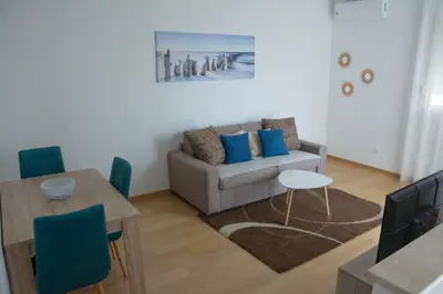 a living room with a couch and a table at Apartments Milica in Becici