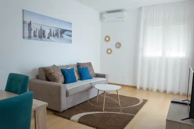 a living room with a couch and a table at Apartments Milica in Becici
