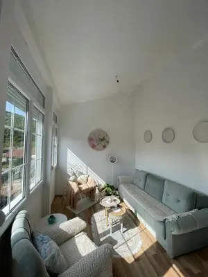 a living room with a couch and a table at Ivana in Rijeka Crnojevića