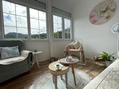 a living room with a couch and a table at Ivana in Rijeka Crnojevića