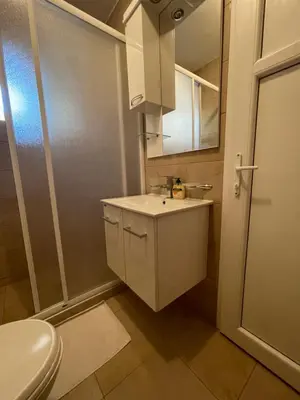 a small bathroom with a sink and a toilet at Luna Apartments in Budva