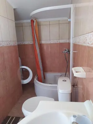 a small bathroom with a toilet and a shower at MonoLiza in Utjeha