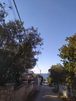 an empty street with a view of the ocean at MonoLiza in Utjeha