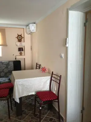 a room with a table and chairs and a couch at MonoLiza in Utjeha