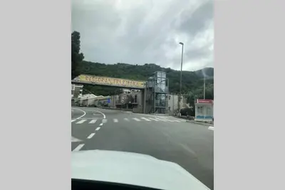 a view from a car of a road with a bridge at Apartments GC 3 in Rafailovici