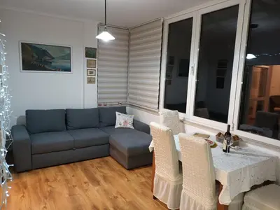 a living room with a couch and a table at Sveti Stefan- Apartment Dora in Sveti Stefan