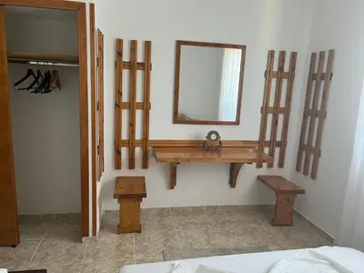 a bathroom with a wooden sink and a mirror at Imperator Apartments in Ulcinj